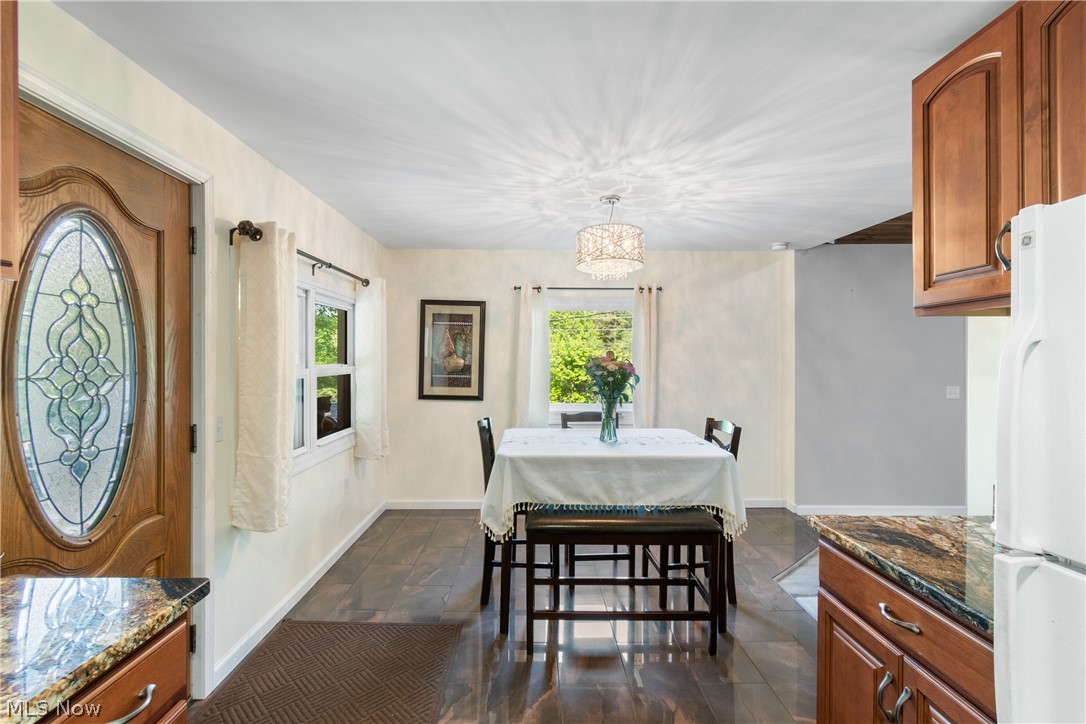 3255 Old Weymouth Road Medina, OH 44256 - Photo 13 of 31 Dining area featuring a wealth of natural light and dark tile flooring