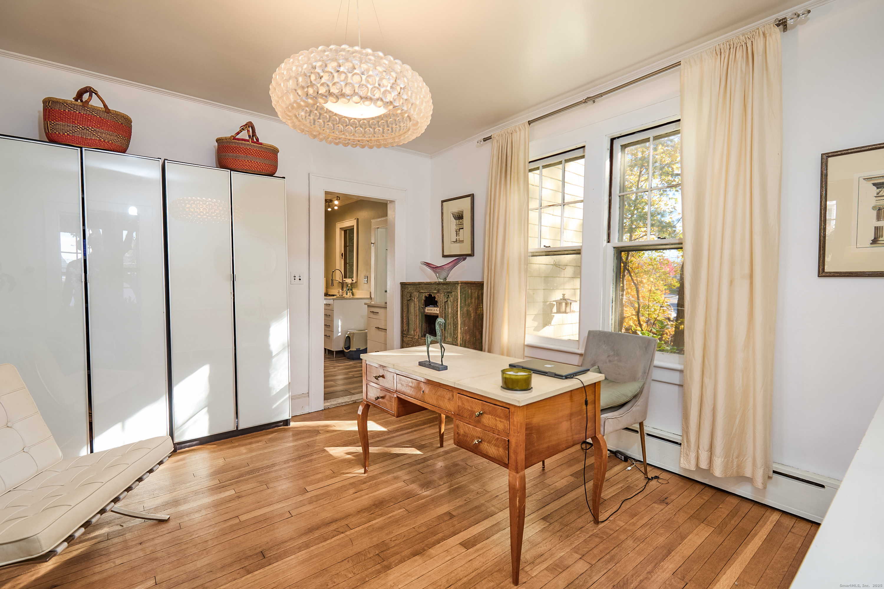 155 Moody Avenue Fairfield, CT 06825 - Photo 11 of 34 a living room with furniture a fireplace and a table