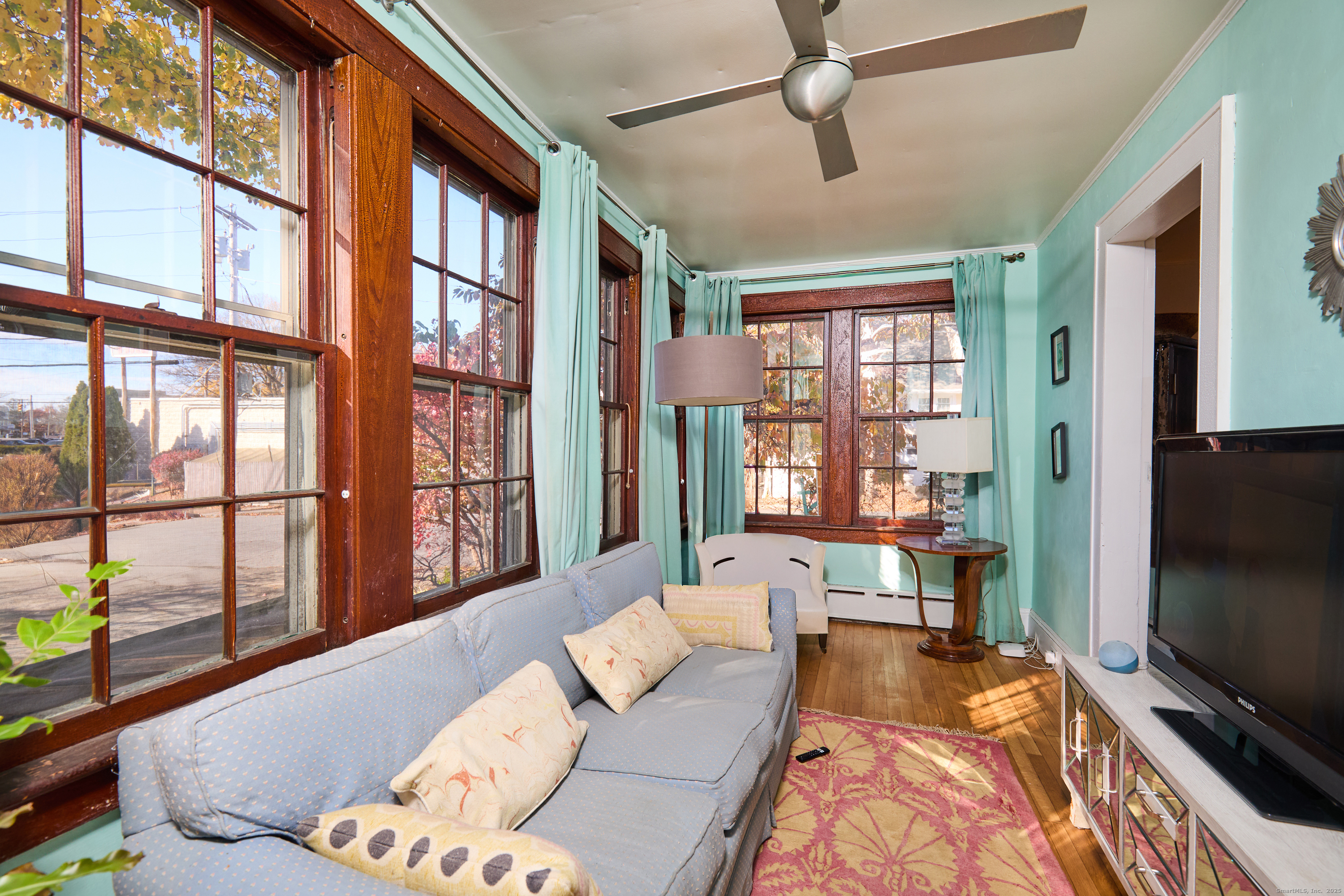155 Moody Avenue Fairfield, CT 06825 - Photo 14 of 34 a living room with furniture tv and a window