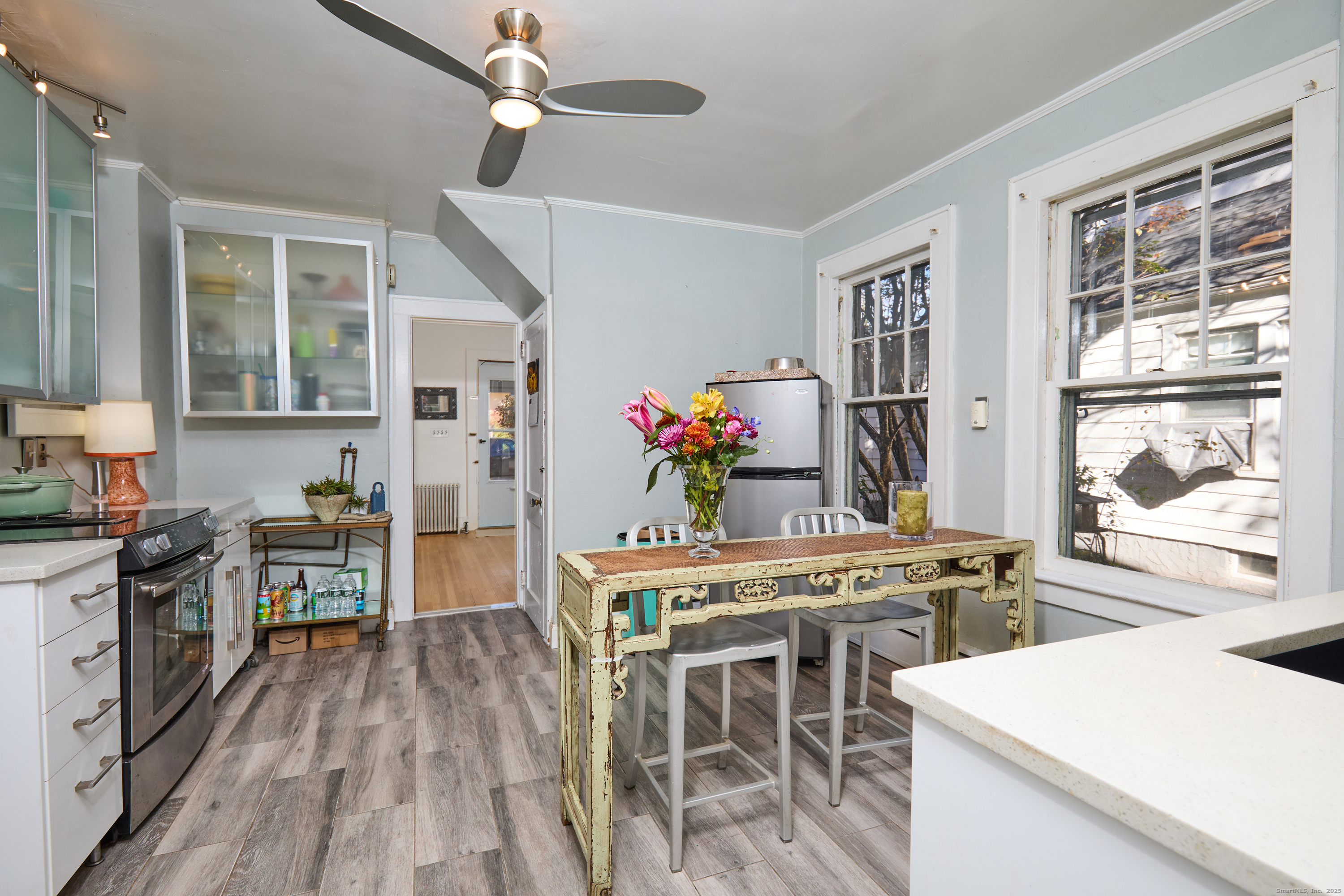 155 Moody Avenue Fairfield, CT 06825 - Photo 17 of 34 a view of a dining room with furniture window and wooden floor