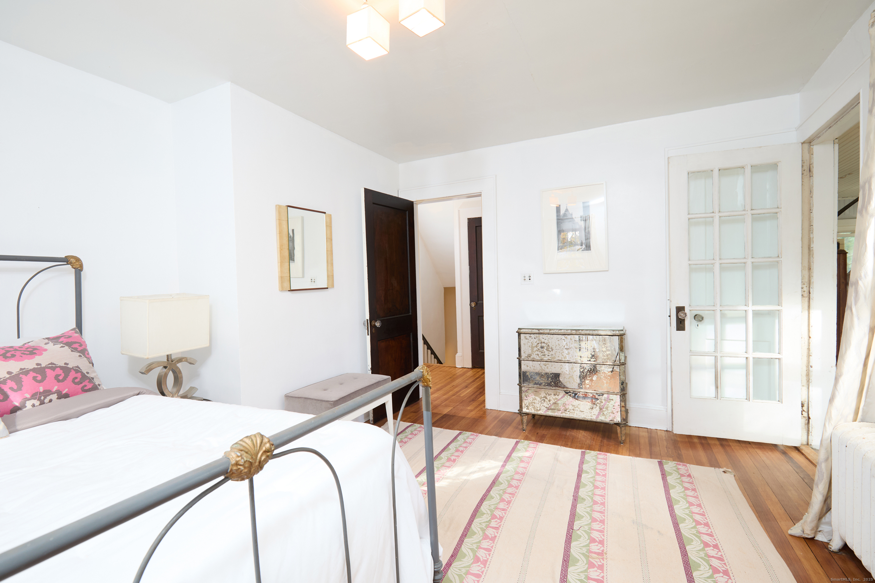 155 Moody Avenue Fairfield, CT 06825 - Photo 23 of 34 a bed room with a bed and a chair