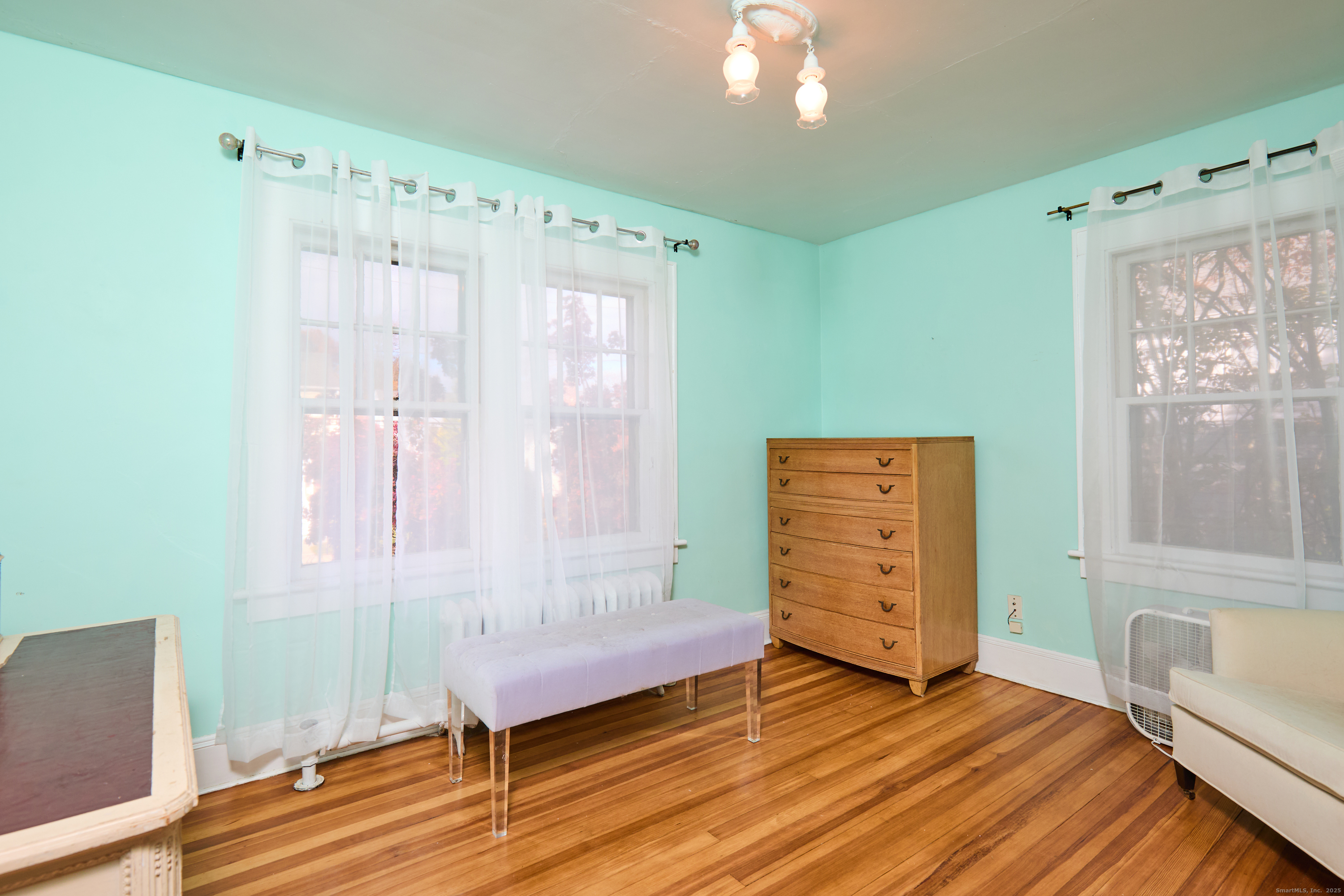 155 Moody Avenue Fairfield, CT 06825 - Photo 26 of 34 a view of a room with wooden floor and cabinet
