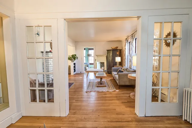 a living room with furniture and a table