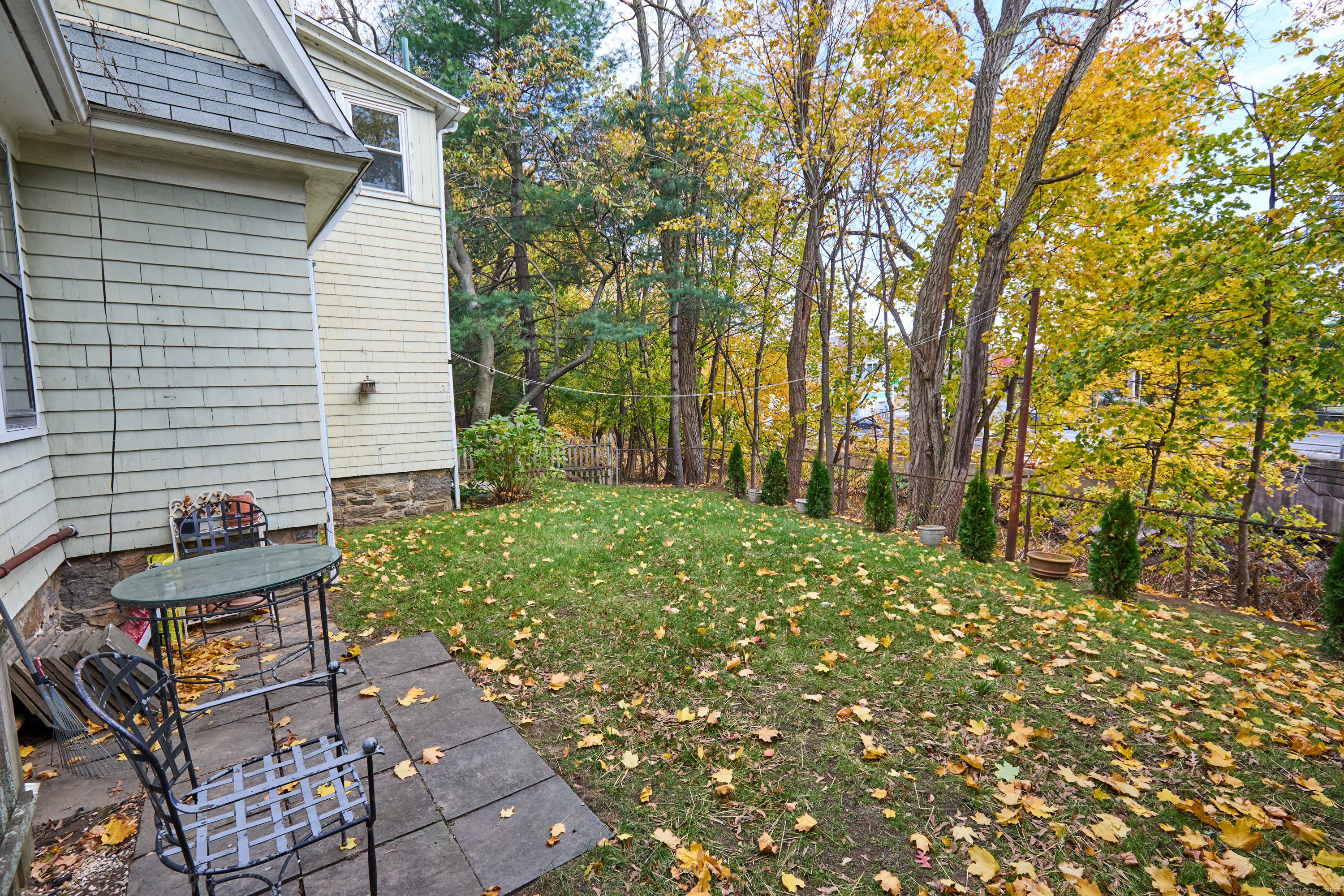 155 Moody Avenue Fairfield, CT 06825 - Photo 33 of 34 a view of a backyard with sitting area
