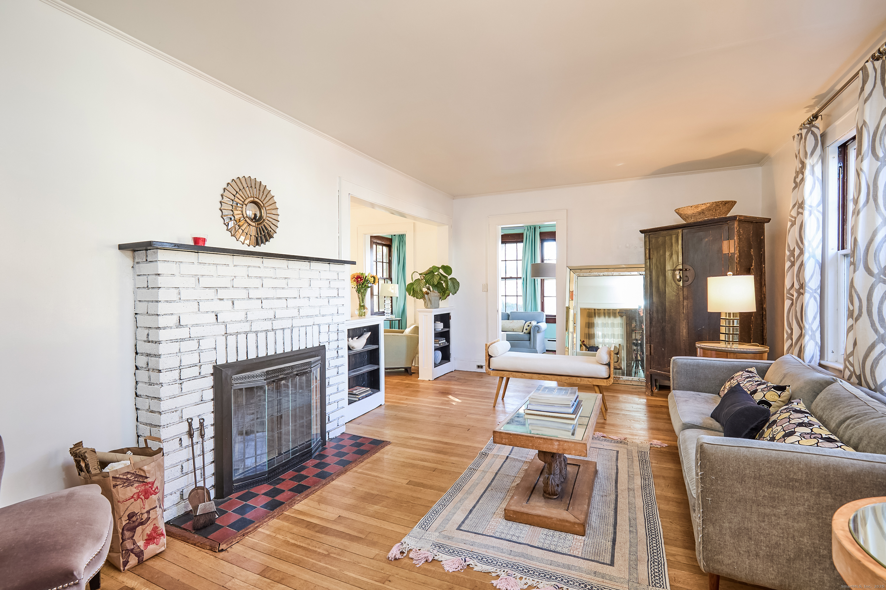 155 Moody Avenue Fairfield, CT 06825 - Photo 6 of 34 a living room with furniture and a fireplace