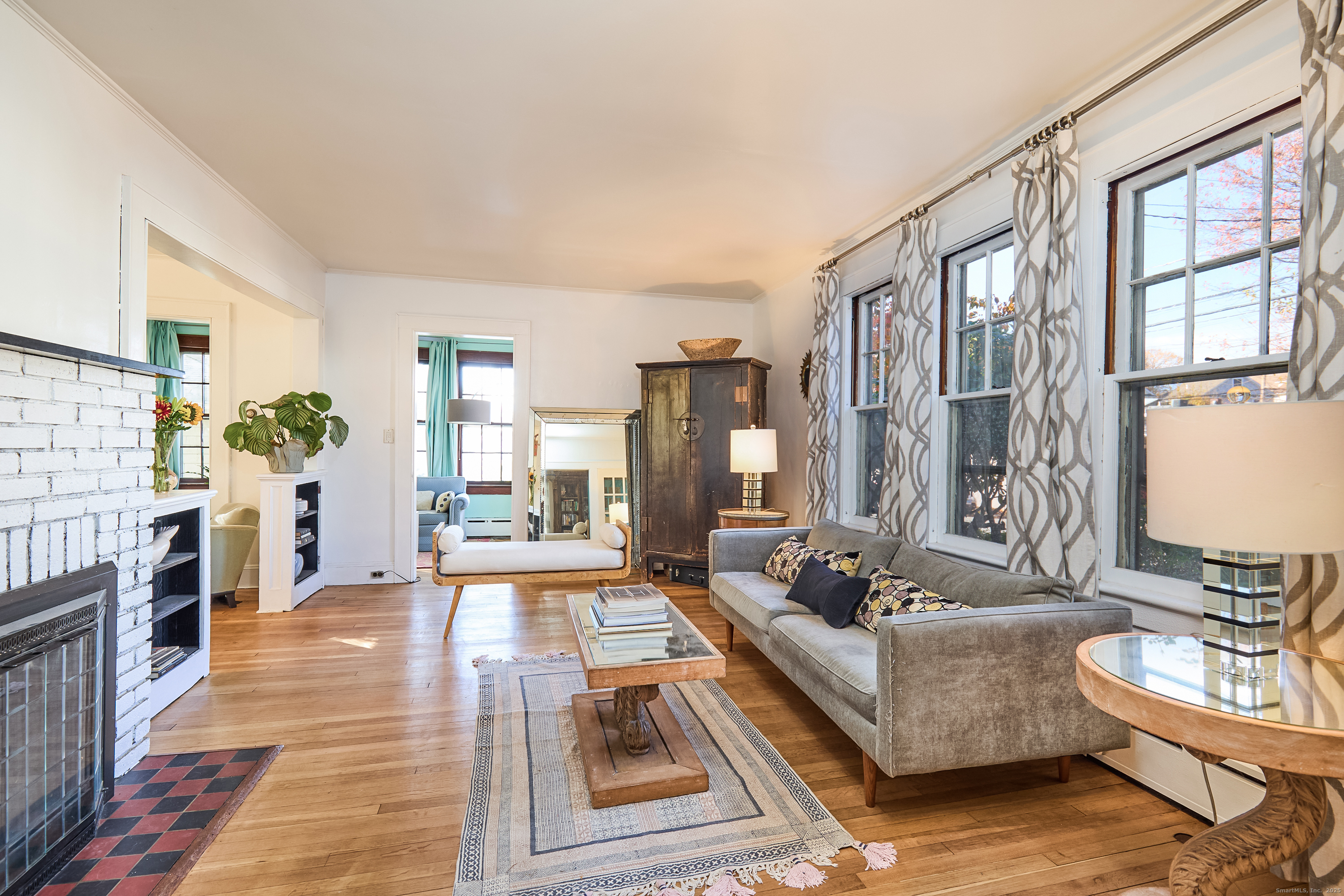 155 Moody Avenue Fairfield, CT 06825 - Photo 7 of 34 a living room with fireplace furniture and a rug