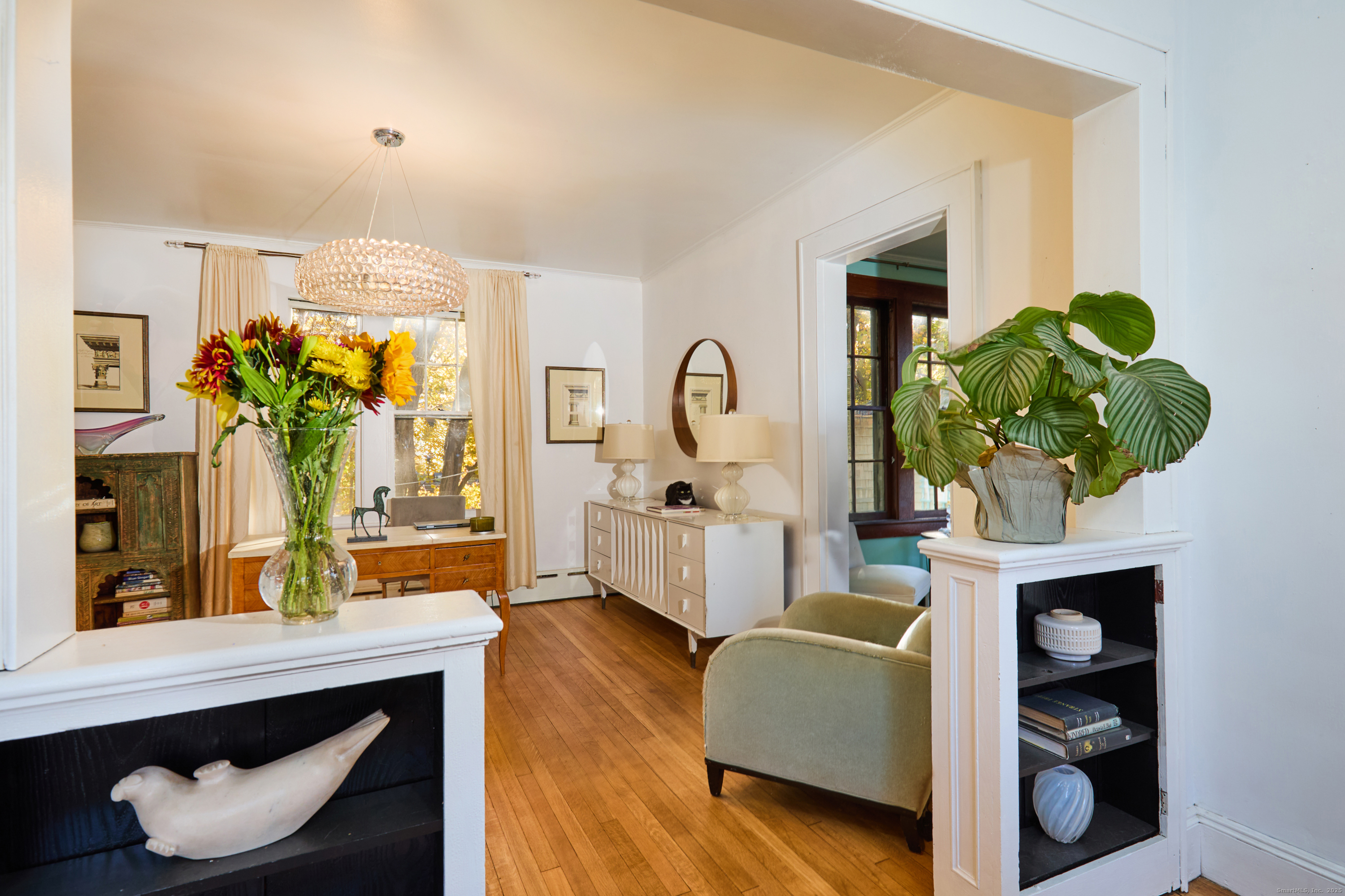 155 Moody Avenue Fairfield, CT 06825 - Photo 8 of 34 a living room with furniture and a potted plant