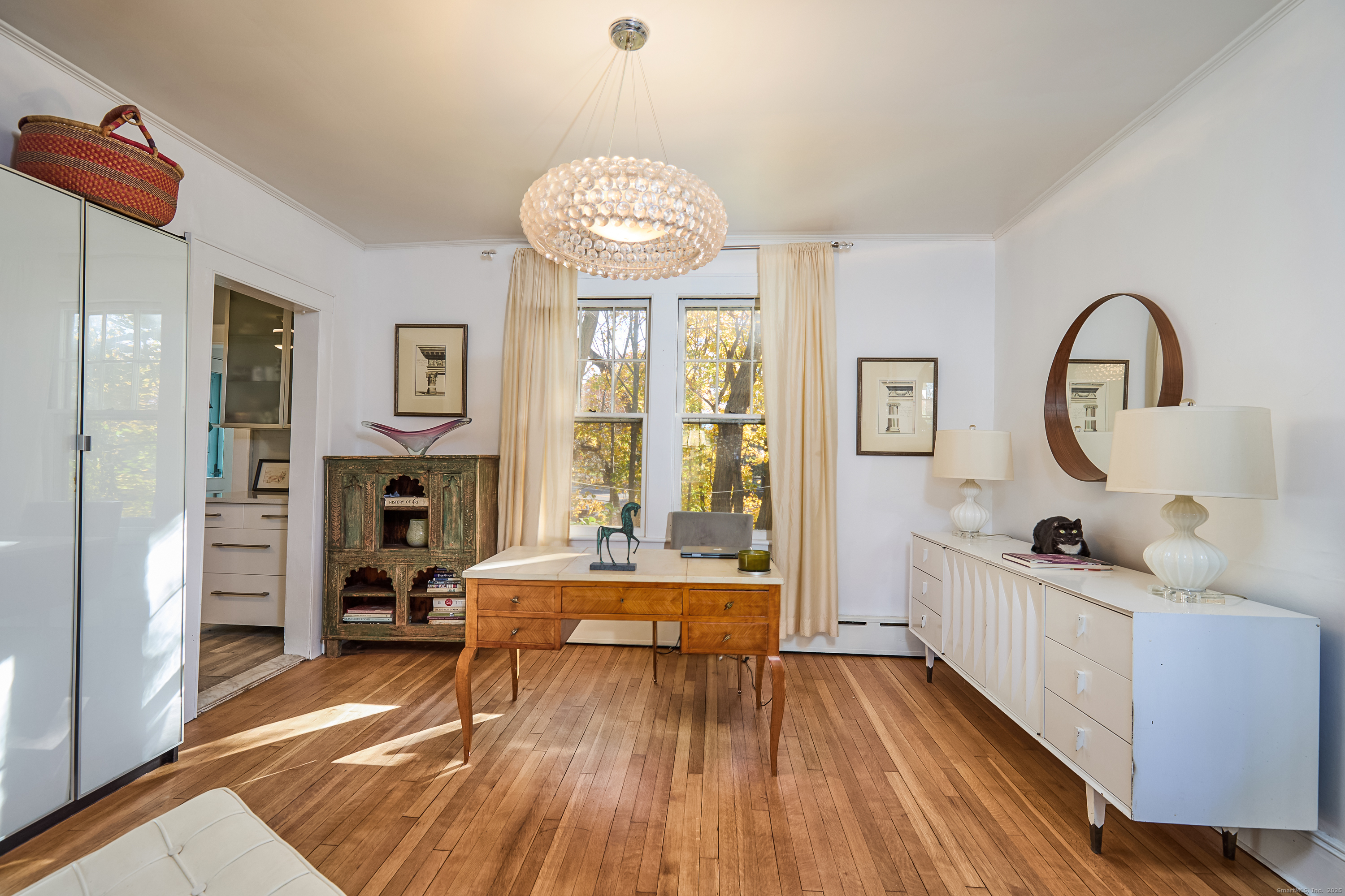 155 Moody Avenue Fairfield, CT 06825 - Photo 10 of 34 a living room with furniture a fireplace and a flat screen tv
