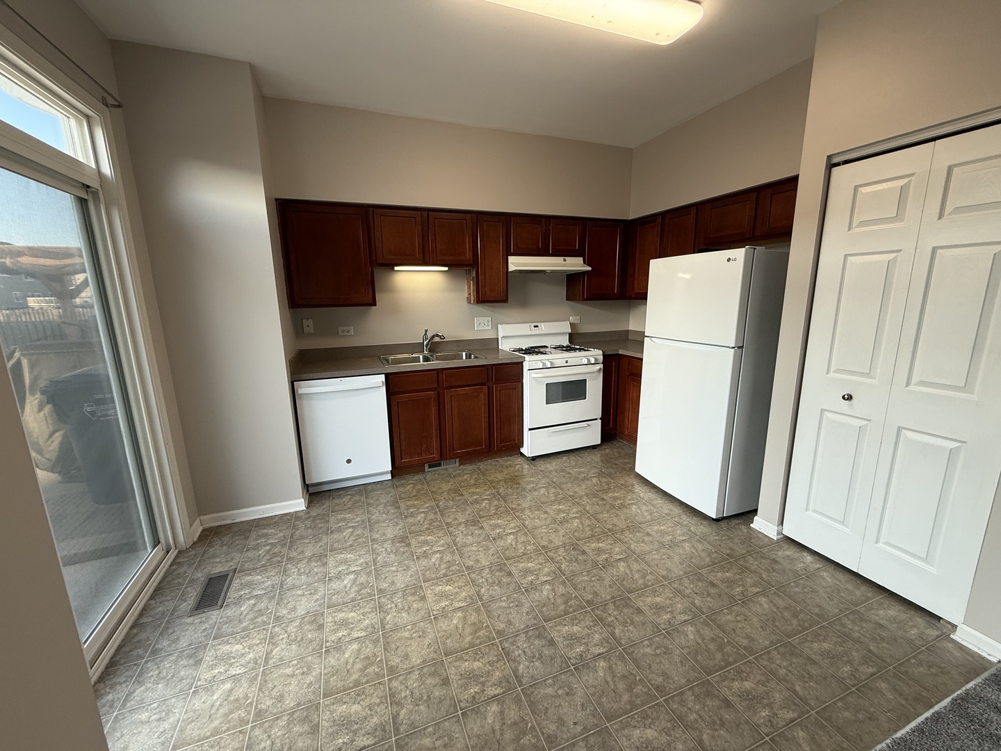 1403 Fabiola Court South Minooka, IL 60447 - Photo 11 of 30 a kitchen with stainless steel appliances a refrigerator and a stove