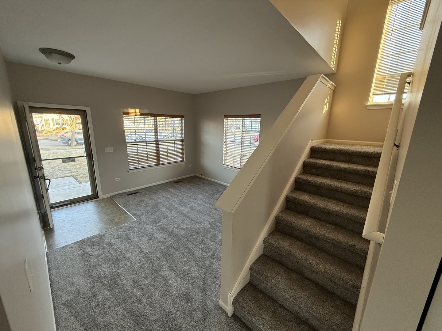 1403 Fabiola Court South Minooka, IL 60447 - Photo 2 of 30 wooden floor in an empty room with windows