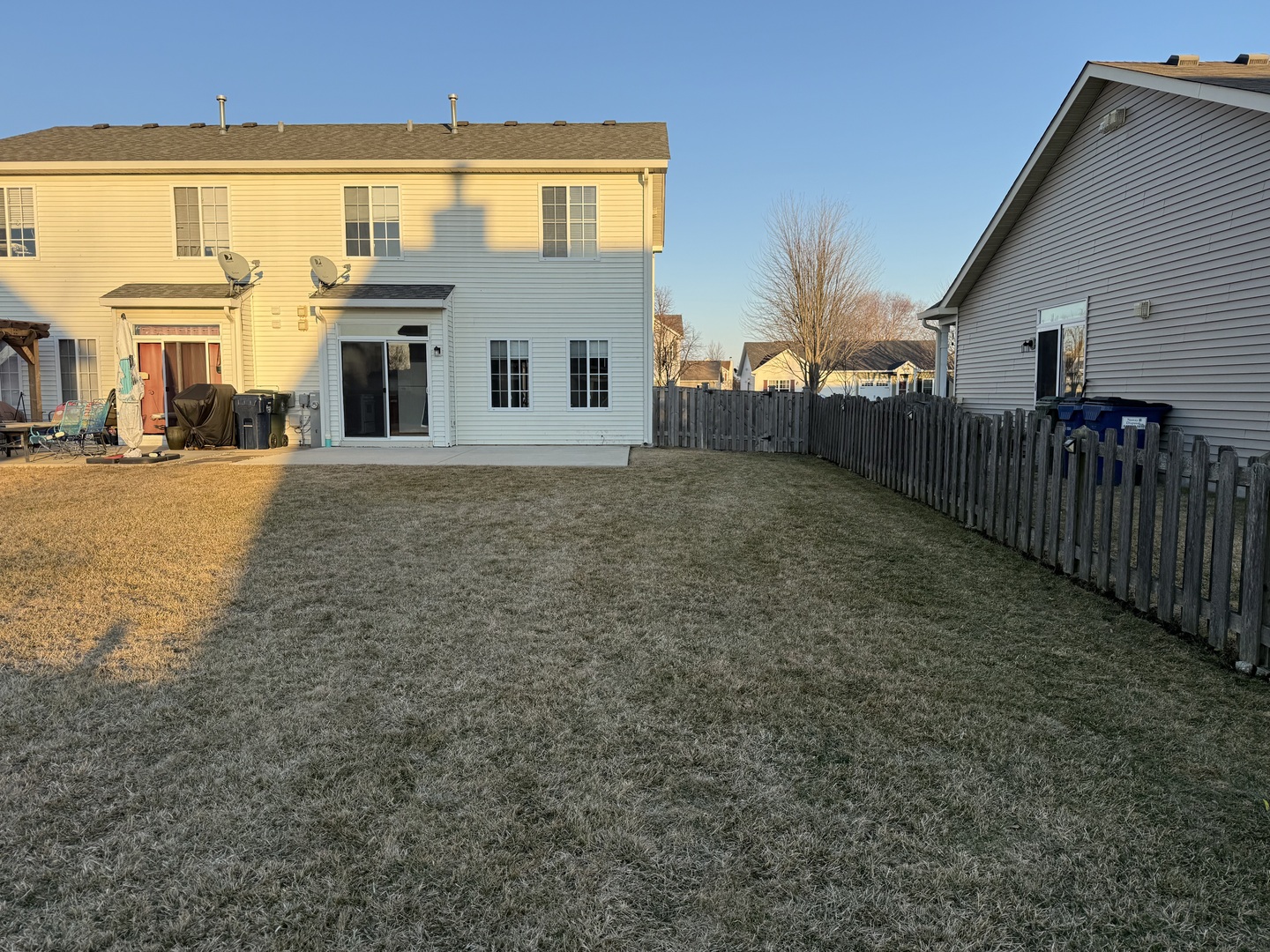 1403 Fabiola Court South Minooka, IL 60447 - Photo 26 of 30 a view of a white house with a yard
