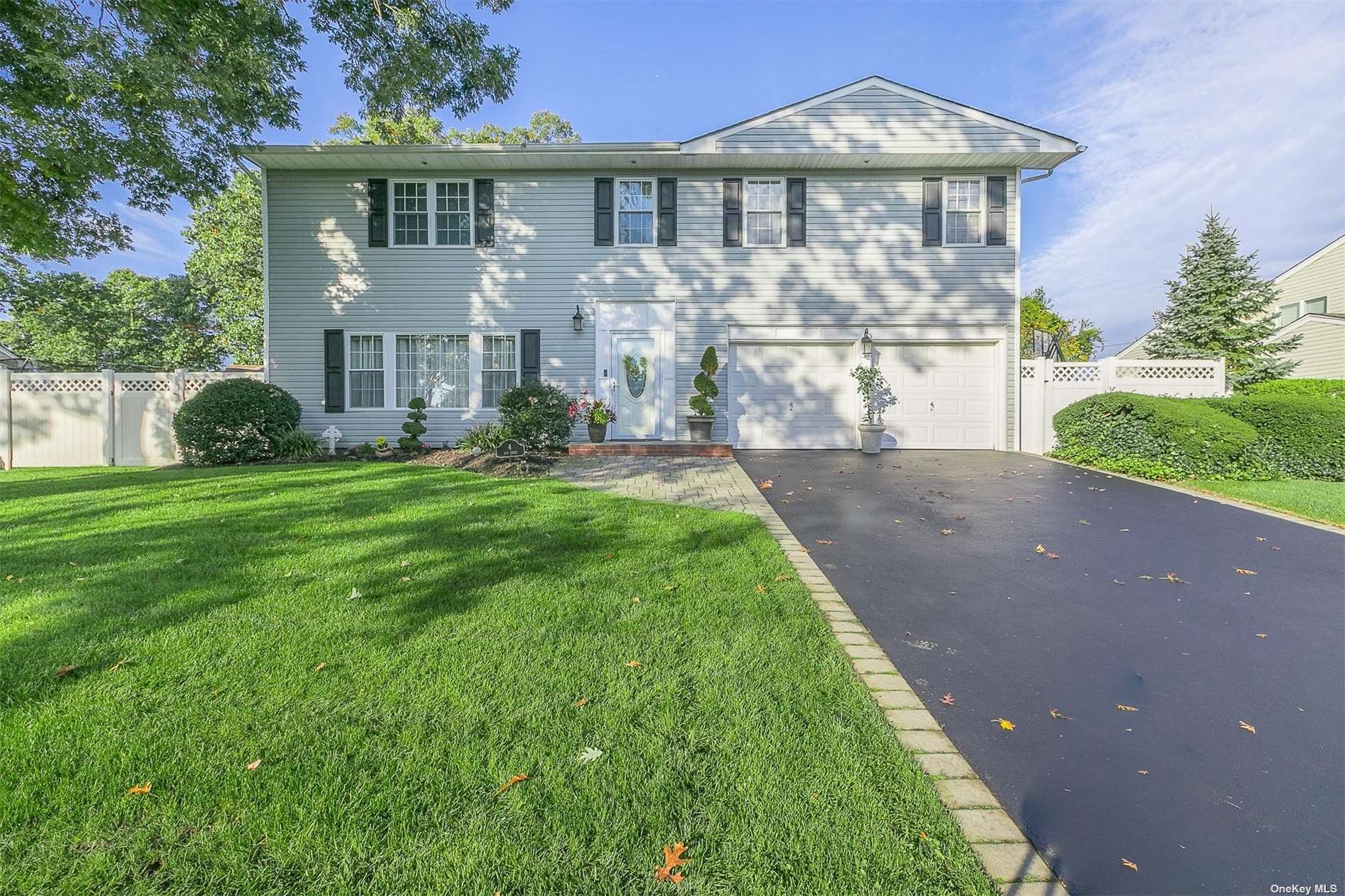 4 Roy Drive Nesconset, NY 11767 - Photo 1 of 1 a front view of a house with a yard