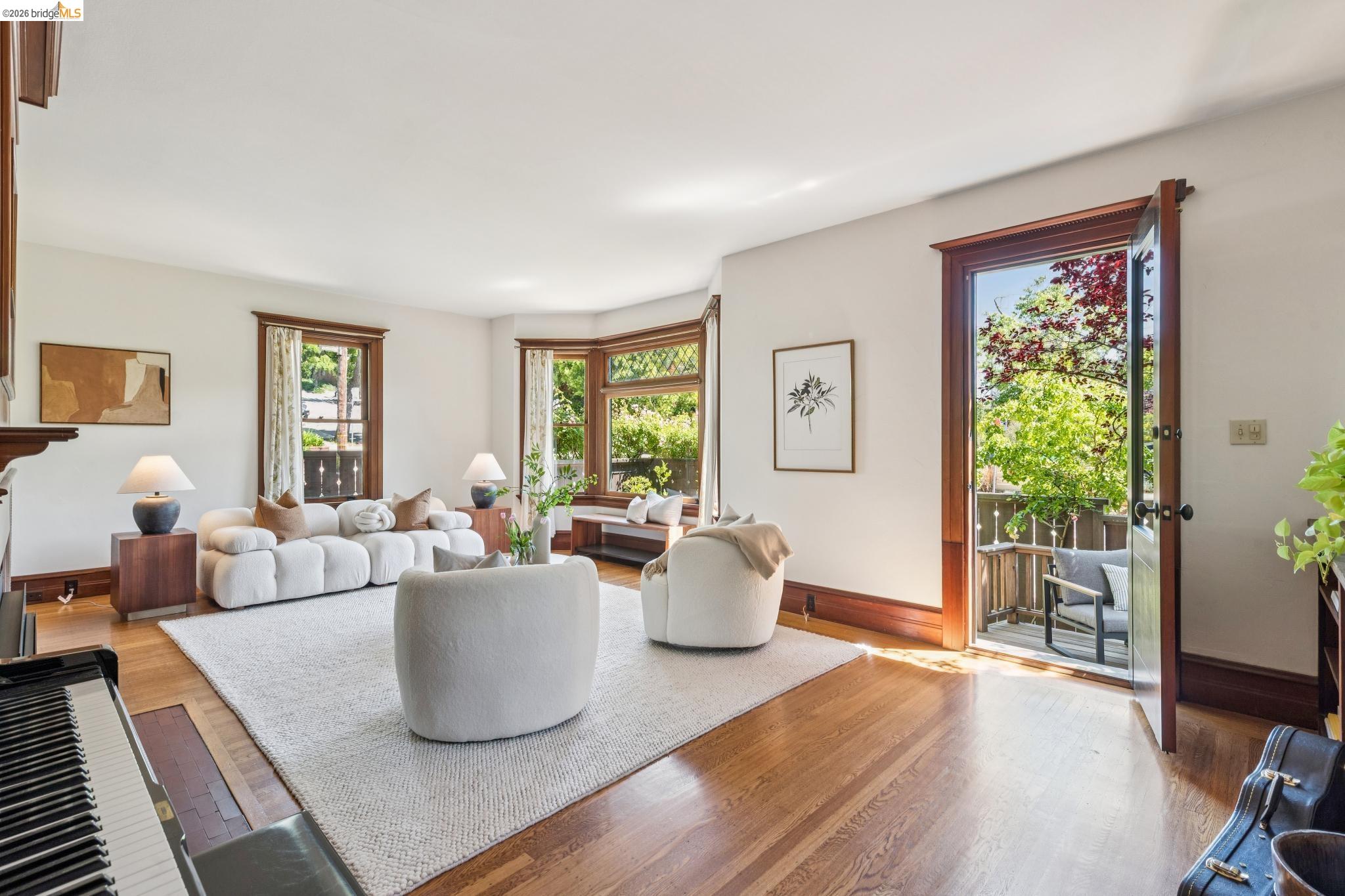 1490 Arch Street Berkeley, CA 94708 - Photo 10 of 57 a living room with furniture and a large window