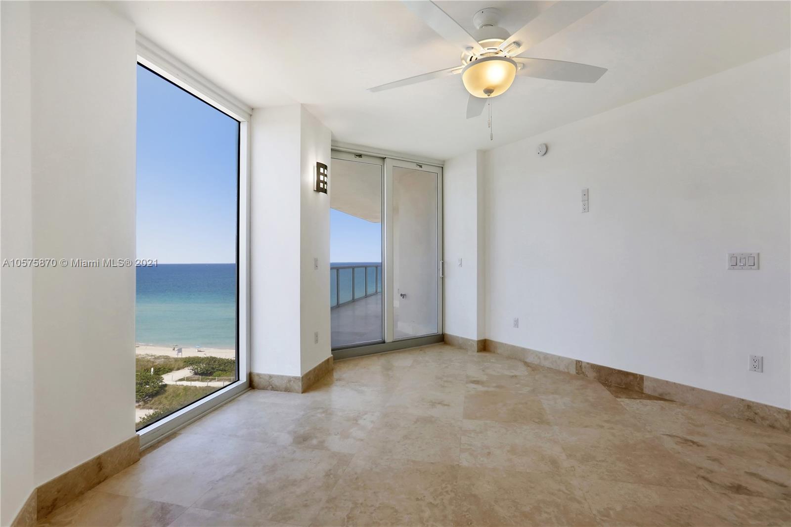 8925 Collins Avenue, Unit 9B Surfside, FL 33154 - Photo 17 of 46 an empty room with closet and fan