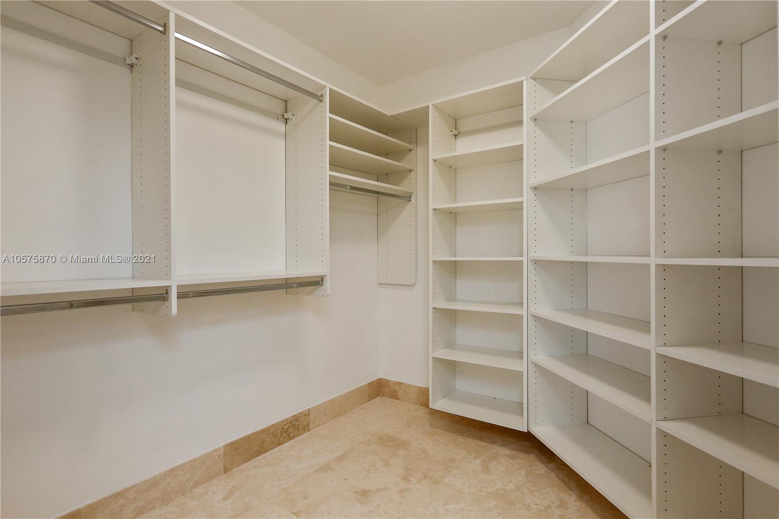 8925 Collins Avenue, Unit 9B Surfside, FL 33154 - Photo 20 of 46 a view of an empty walk in closet