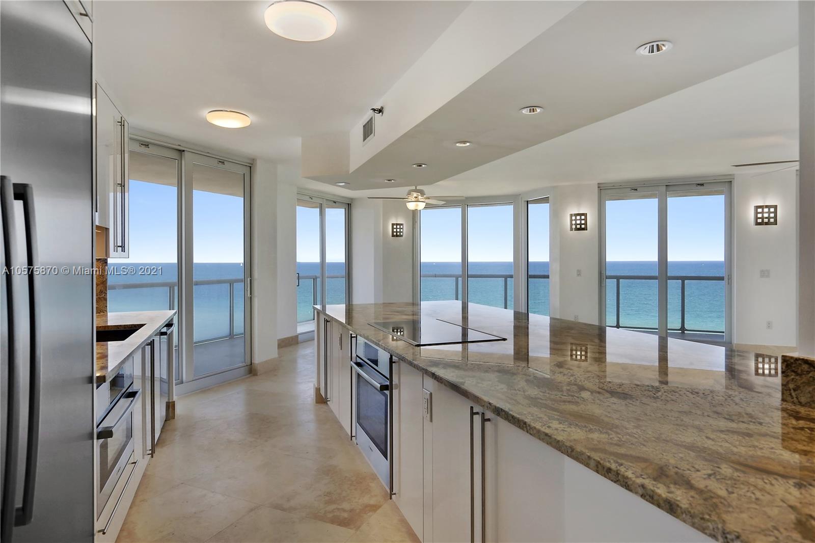 8925 Collins Avenue, Unit 9B Surfside, FL 33154 - Photo 2 of 46 a large kitchen with granite countertop a large counter top appliances and cabinets
