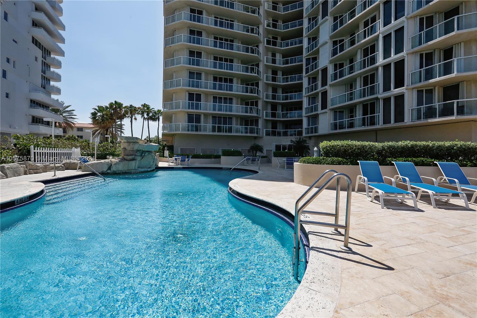 8925 Collins Avenue, Unit 9B Surfside, FL 33154 - Photo 27 of 46 a view of a patio with a table and chairs