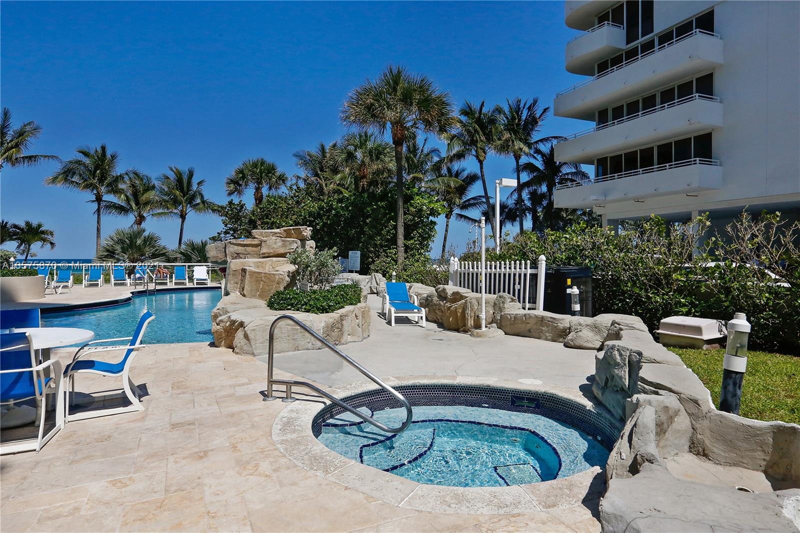 8925 Collins Avenue, Unit 9B Surfside, FL 33154 - Photo 28 of 46 a view of a swimming pool with chairs
