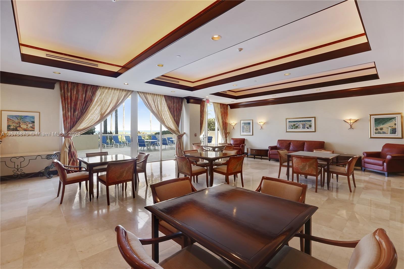 8925 Collins Avenue, Unit 9B Surfside, FL 33154 - Photo 32 of 46 a view of a dining room with furniture