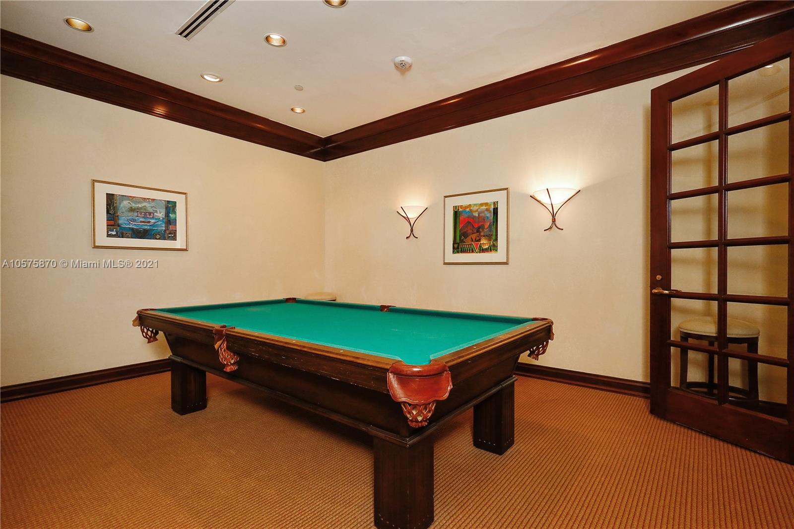 8925 Collins Avenue, Unit 9B Surfside, FL 33154 - Photo 35 of 46 a room with pool table and windows