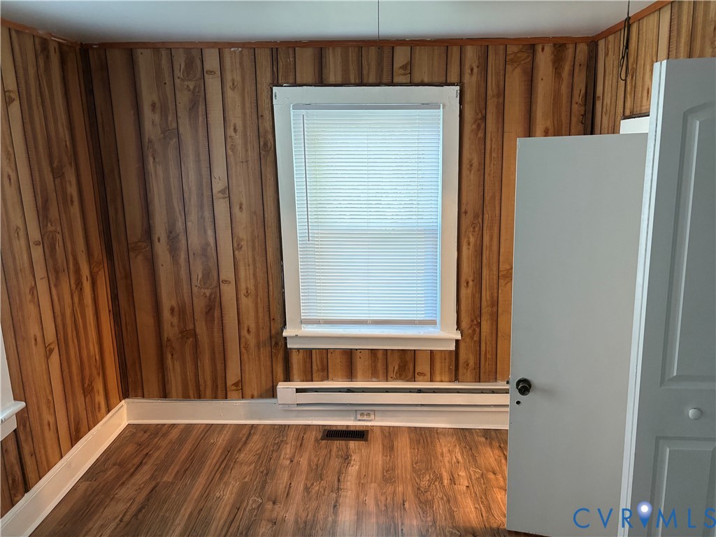 1904 Arlington Road Hopewell, VA 23860 - Photo 4 of 13 Unfurnished room featuring wooden walls, dark wood