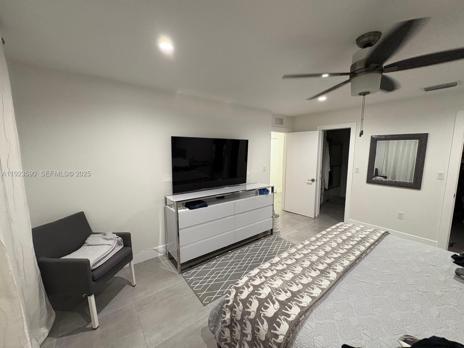 7119 Southwest 105th Court Miami, FL 33173 - Photo 12 of 19 a living room with furniture and a flat screen tv