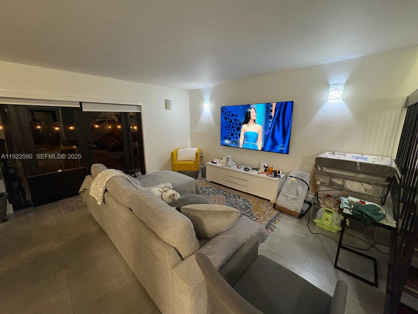 7119 Southwest 105th Court Miami, FL 33173 - Photo 6 of 19 a living room with furniture