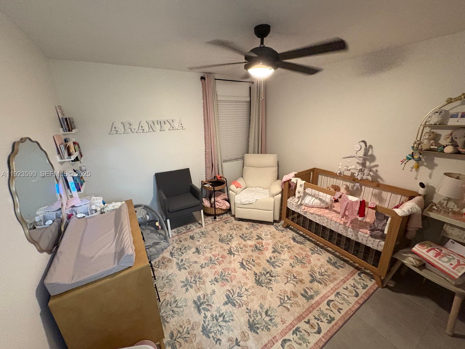 7119 Southwest 105th Court Miami, FL 33173 - Photo 9 of 19 a living room with furniture and a rug
