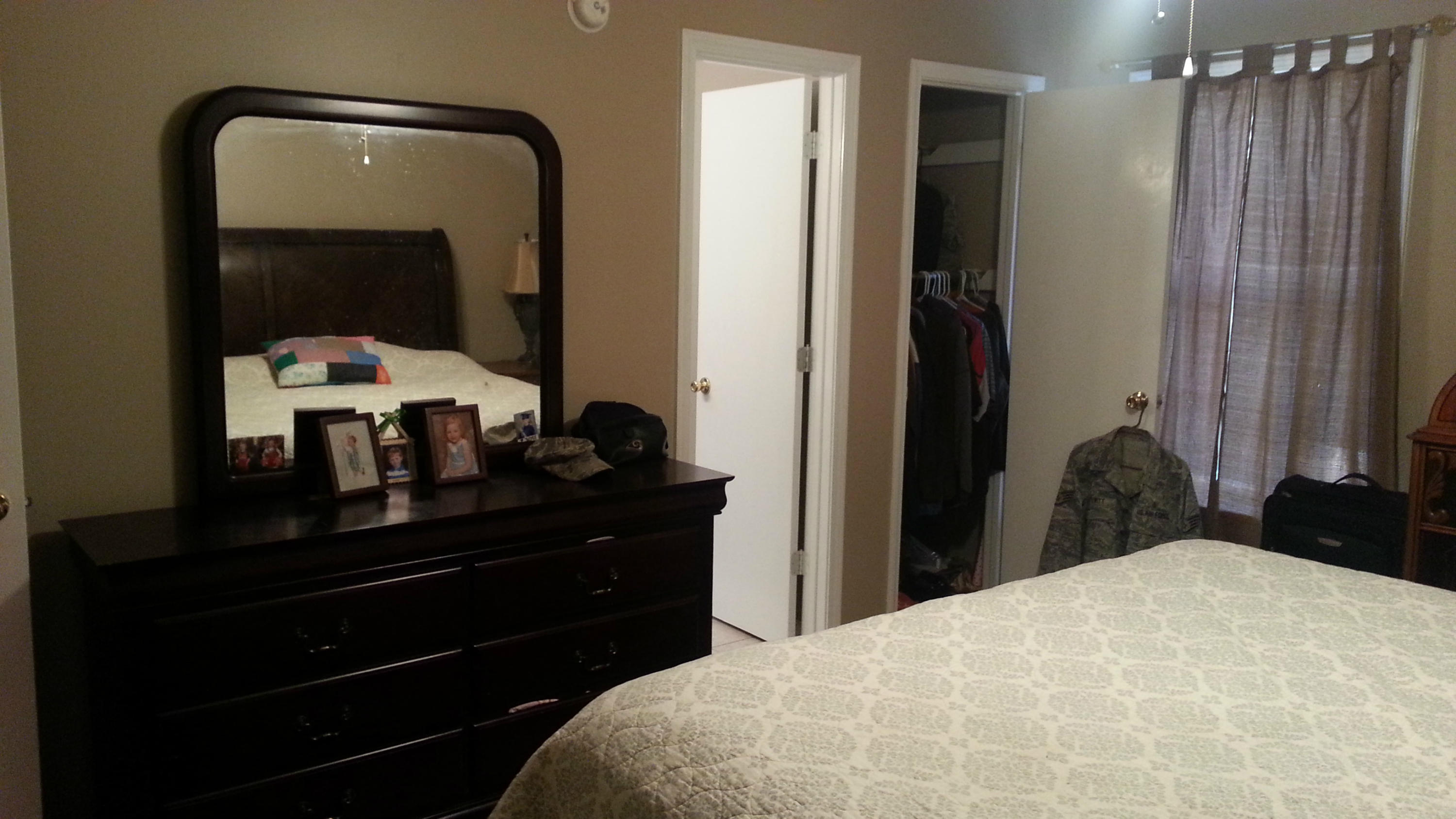 348 John King Road Crestview, FL 32539 - Photo 12 of 19 a bedroom with a bed and a mirror