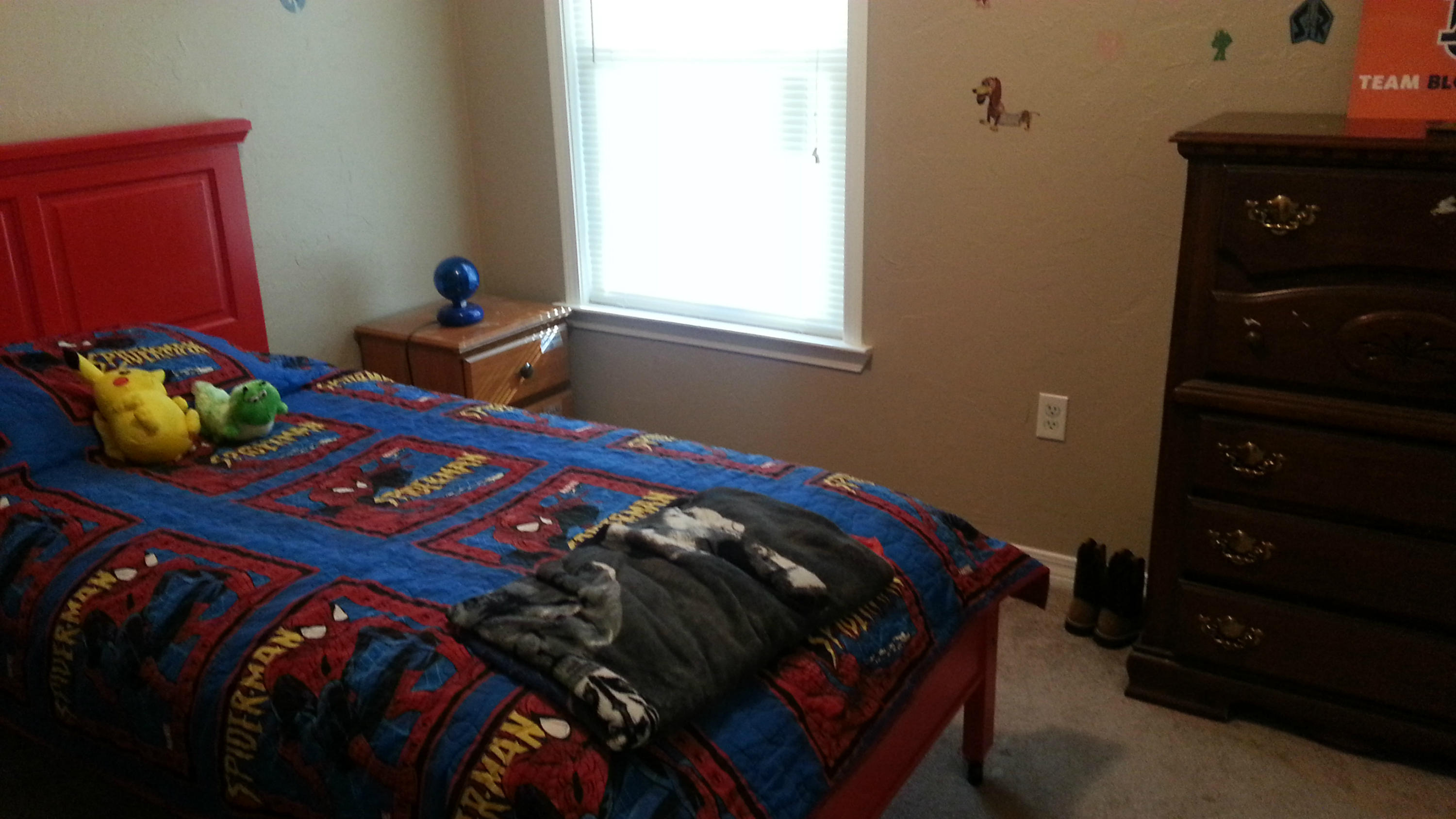 348 John King Road Crestview, FL 32539 - Photo 14 of 19 a bed sitting in a bedroom next to a window