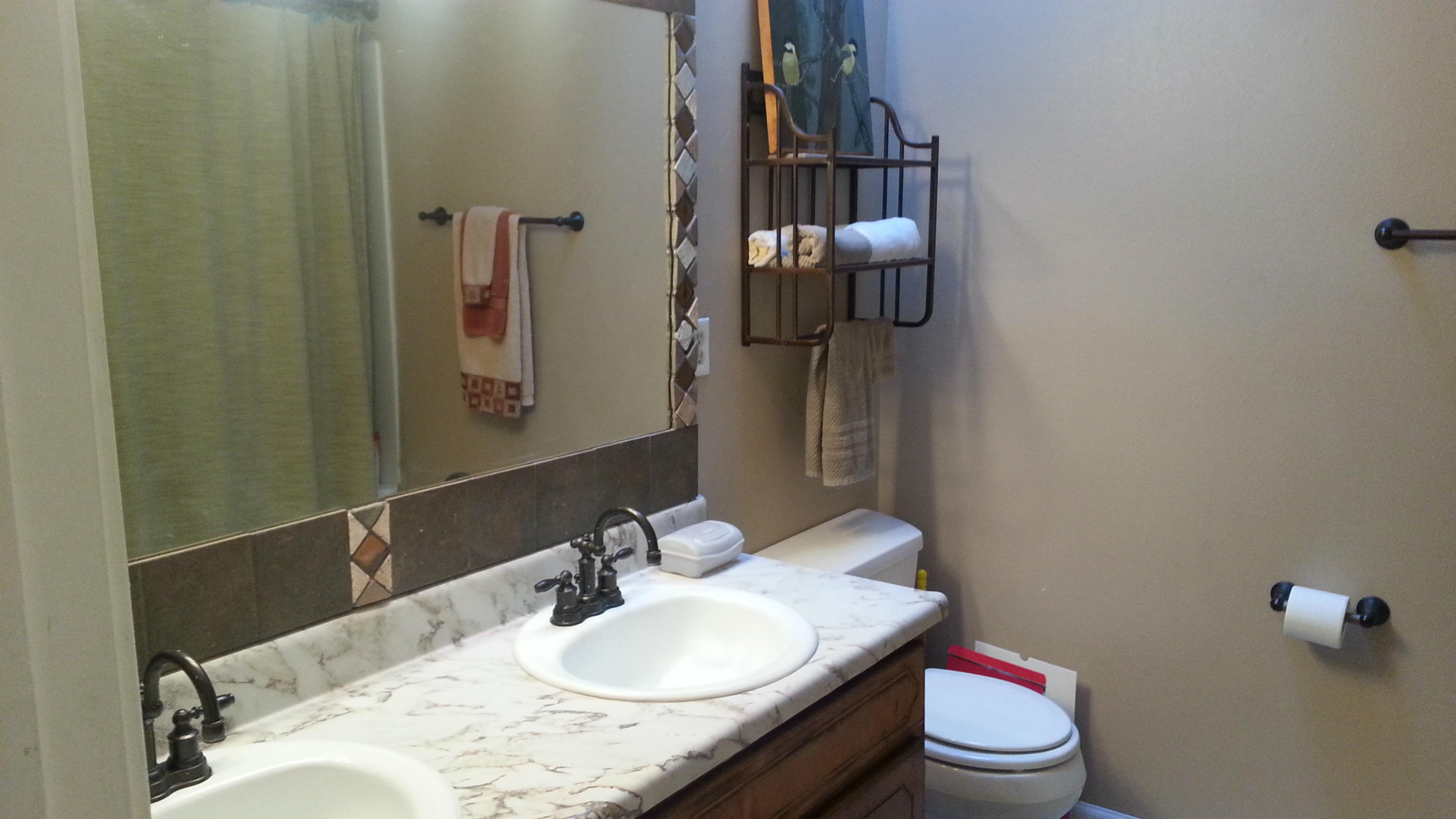 348 John King Road Crestview, FL 32539 - Photo 16 of 19 a bathroom with a granite countertop sink toilet and mirror