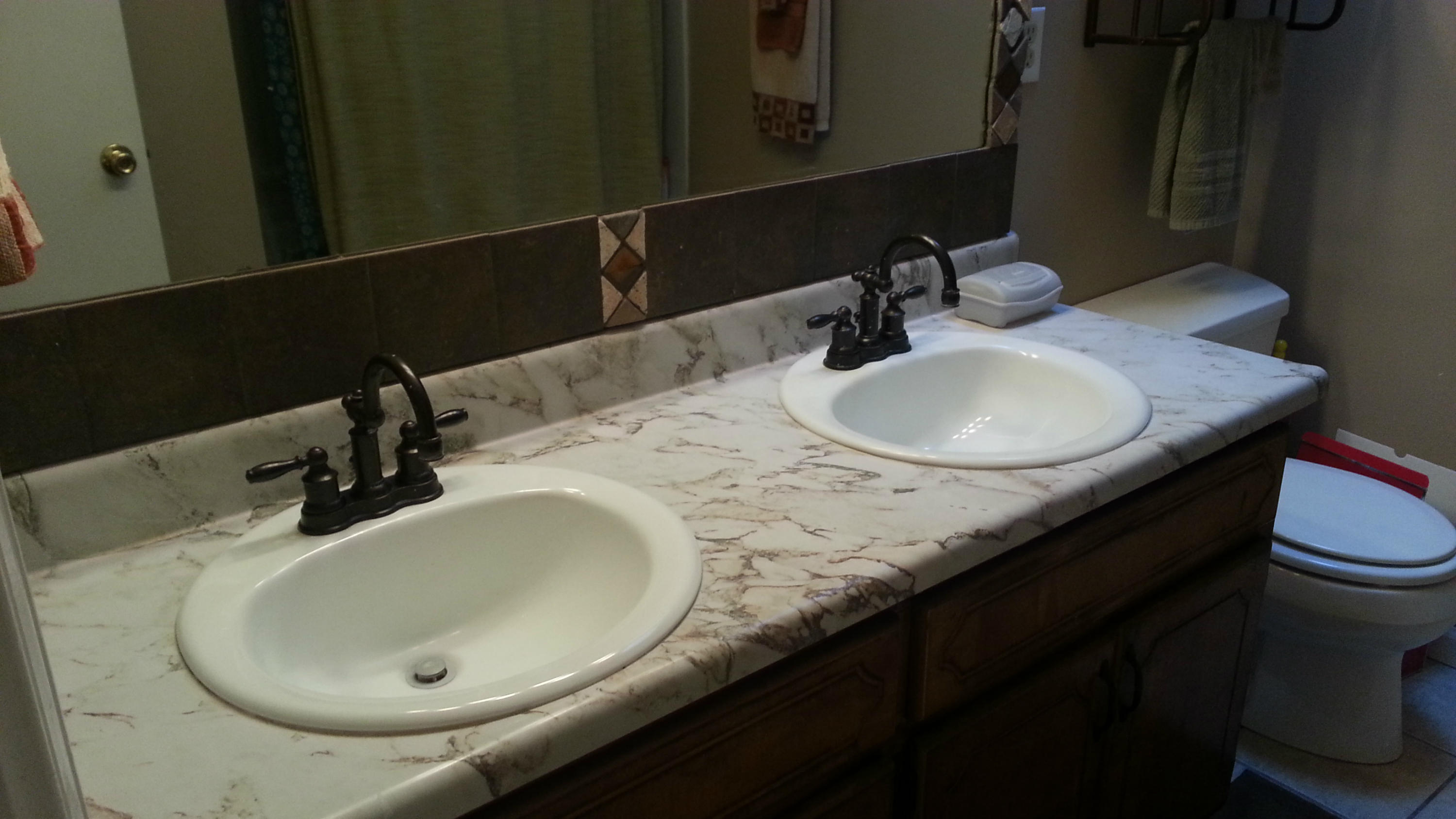 348 John King Road Crestview, FL 32539 - Photo 17 of 19 a bathroom with a granite countertop sink a mirror and vanity