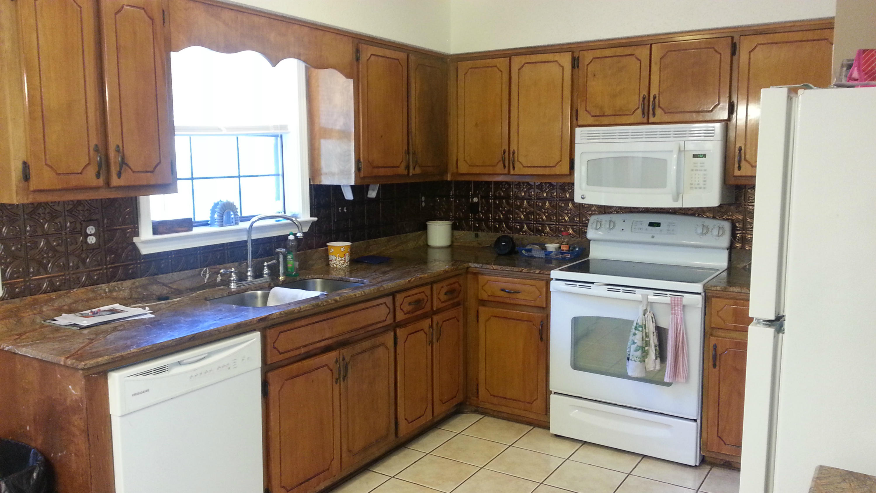348 John King Road Crestview, FL 32539 - Photo 6 of 19 a kitchen with a sink stove and refrigerator