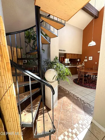 a view of a balcony with furniture and floor to ceiling window