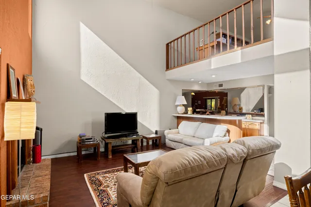 a kitchen with stainless steel appliances kitchen island a table and chairs in it