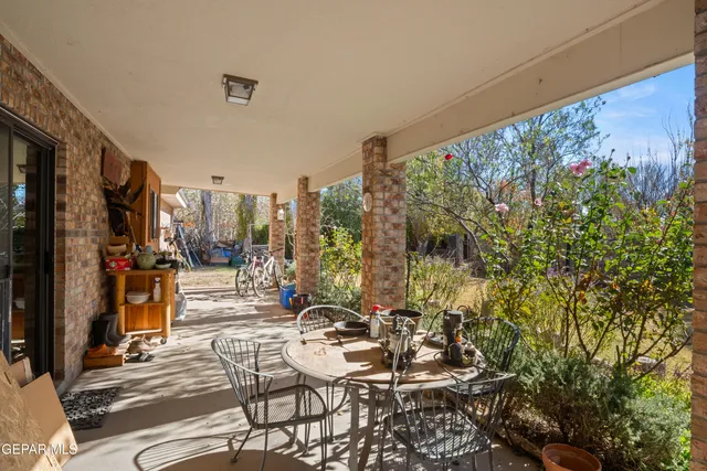 a view of garage with a tree
