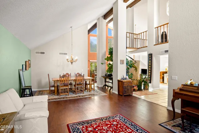 a living room with fireplace furniture and a floor to ceiling window