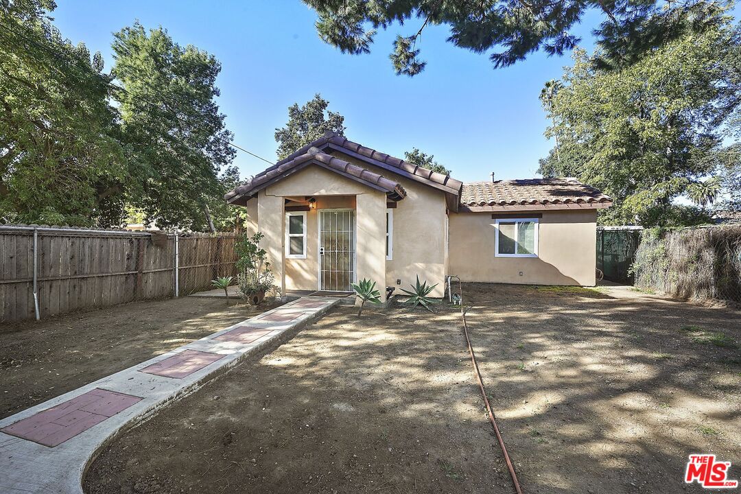 1945 Summit Avenue Pasadena, CA 91103 - Photo 15 of 15 a view of a yard with a house and a tree
