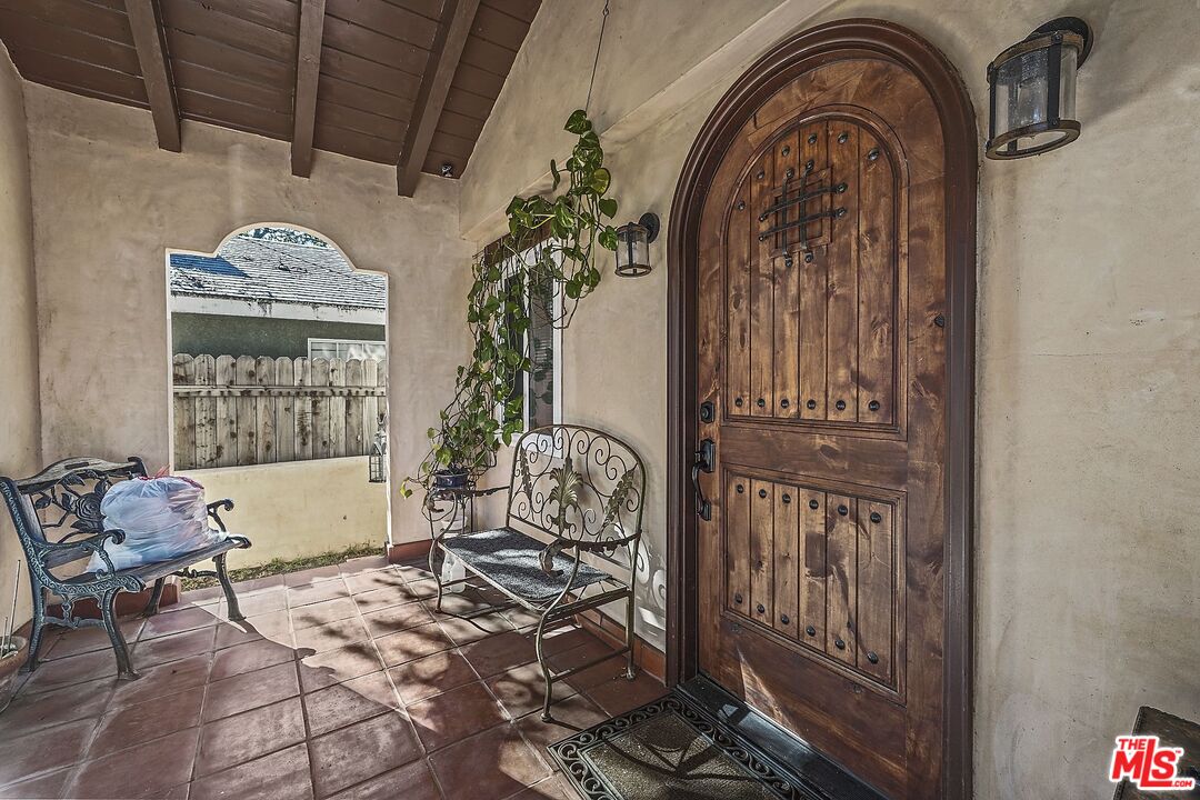 1945 Summit Avenue Pasadena, CA 91103 - Photo 3 of 15 a view of porch with a table and chairs