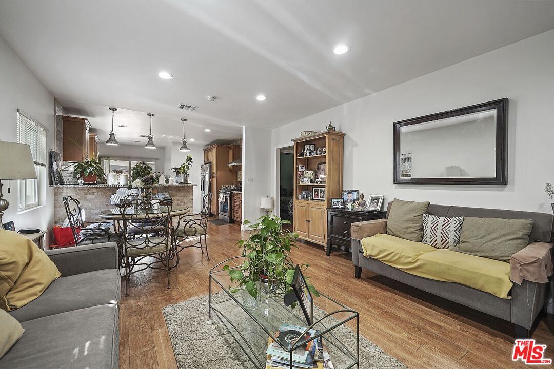 1945 Summit Avenue Pasadena, CA 91103 - Photo 4 of 15 a living room with furniture and a view of kitchen