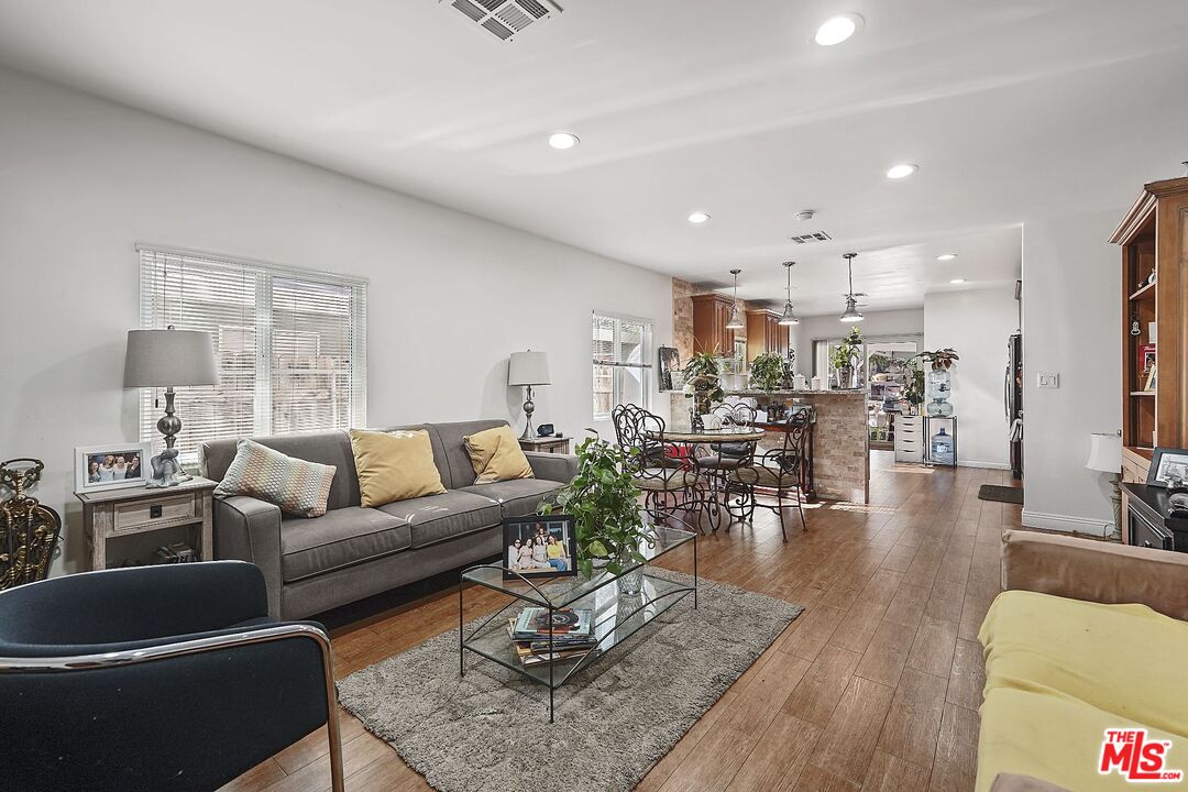 1945 Summit Avenue Pasadena, CA 91103 - Photo 5 of 15 a living room with furniture kitchen view and a large window