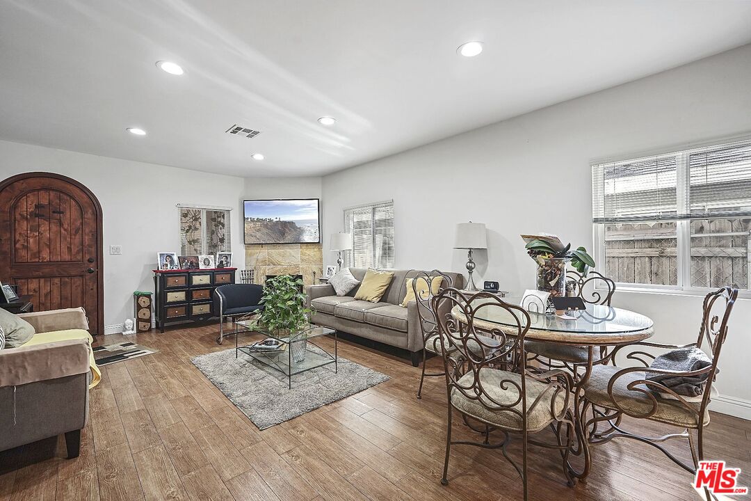 1945 Summit Avenue Pasadena, CA 91103 - Photo 6 of 15 a living room with furniture and wooden floor