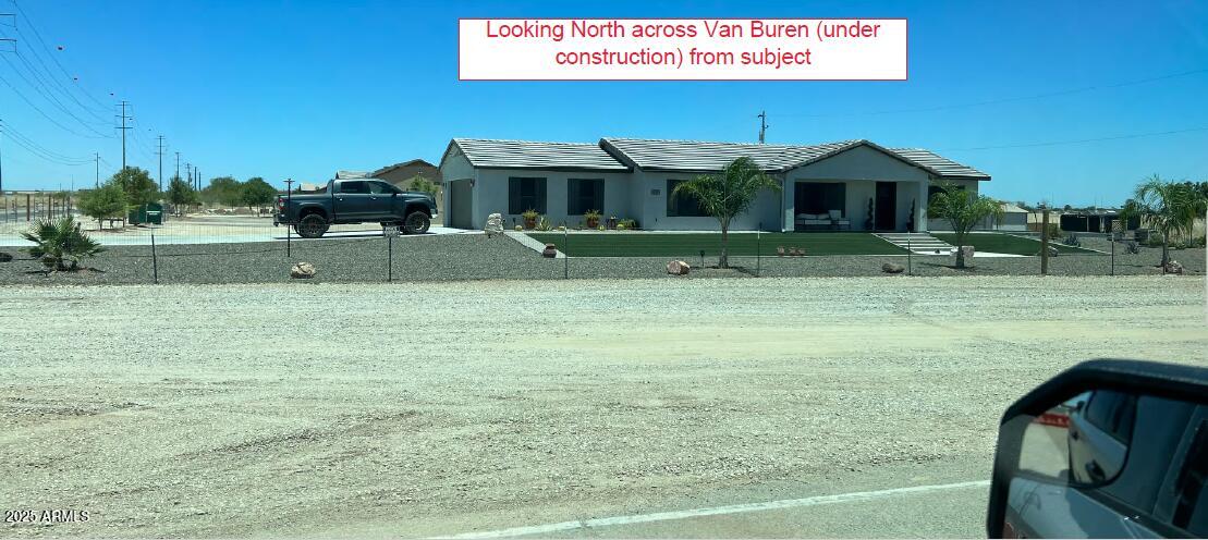 219 North Perryville Road Goodyear, AZ 85338 - Photo 5 of 6 a front view of a house with garden