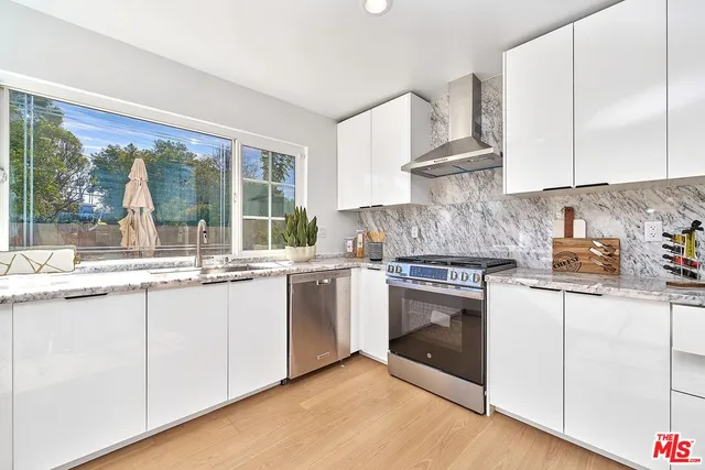 a bedroom with a bed and a view of bathroom