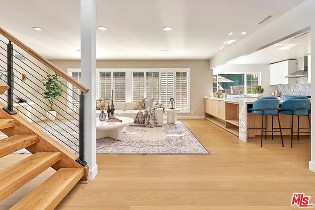 a view of a dining room with furniture and window