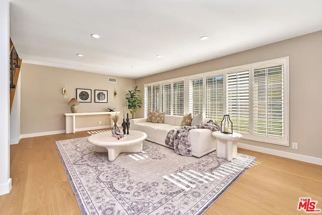 a view of a livingroom with furniture and wooden floor