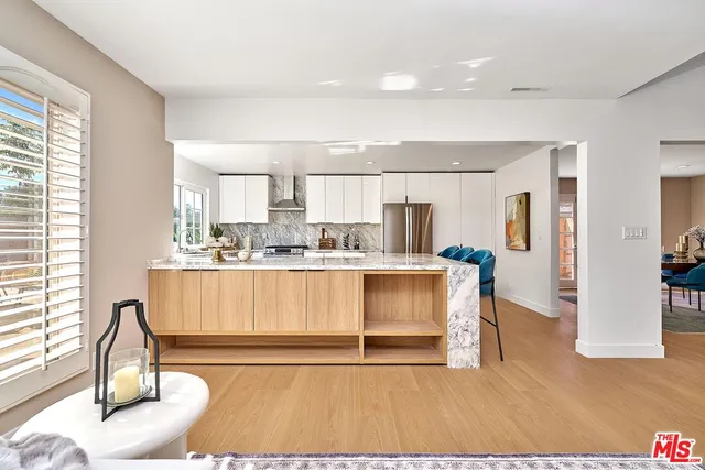 a bedroom with a large bed and a couch