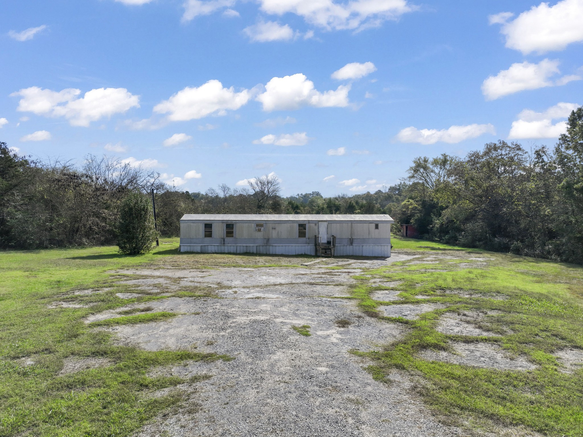 1972 Hill Road Eagleville, TN 37060 - Photo 3 of 4 a backyard of a house with table and chairs