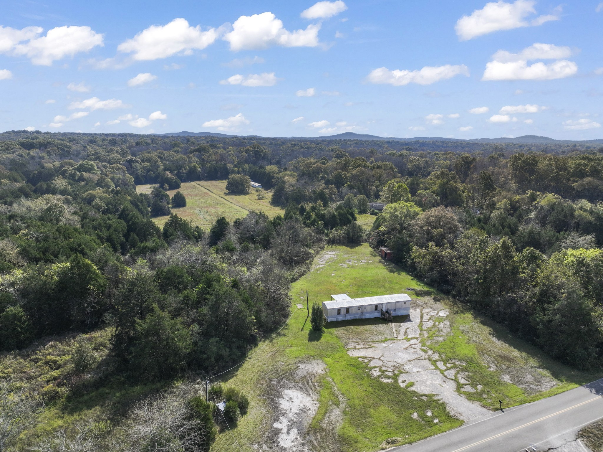 1972 Hill Road Eagleville, TN 37060 - Photo 4 of 4 an aerial view of a house with a yard
