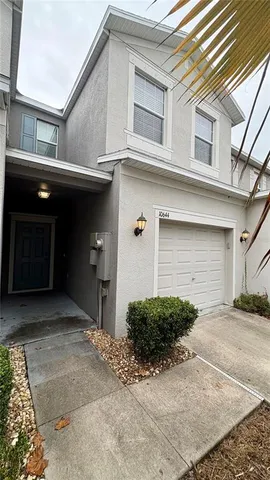 a front view of a house with garage